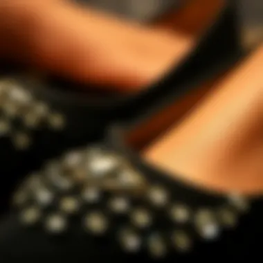 Close-up of rhinestones on black footwear
