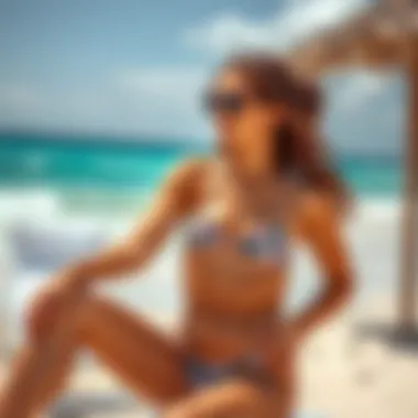 Model styling the high waisted bikini on the beach