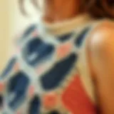 A close-up of a knit crop tank showcasing intricate patterns and textures.