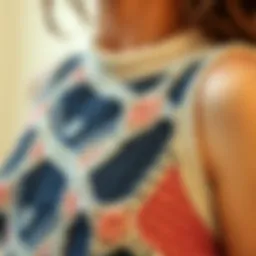 A close-up of a knit crop tank showcasing intricate patterns and textures.