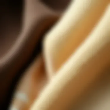 Close-up of fabric swatches in neutral shades highlighting their texture and quality.